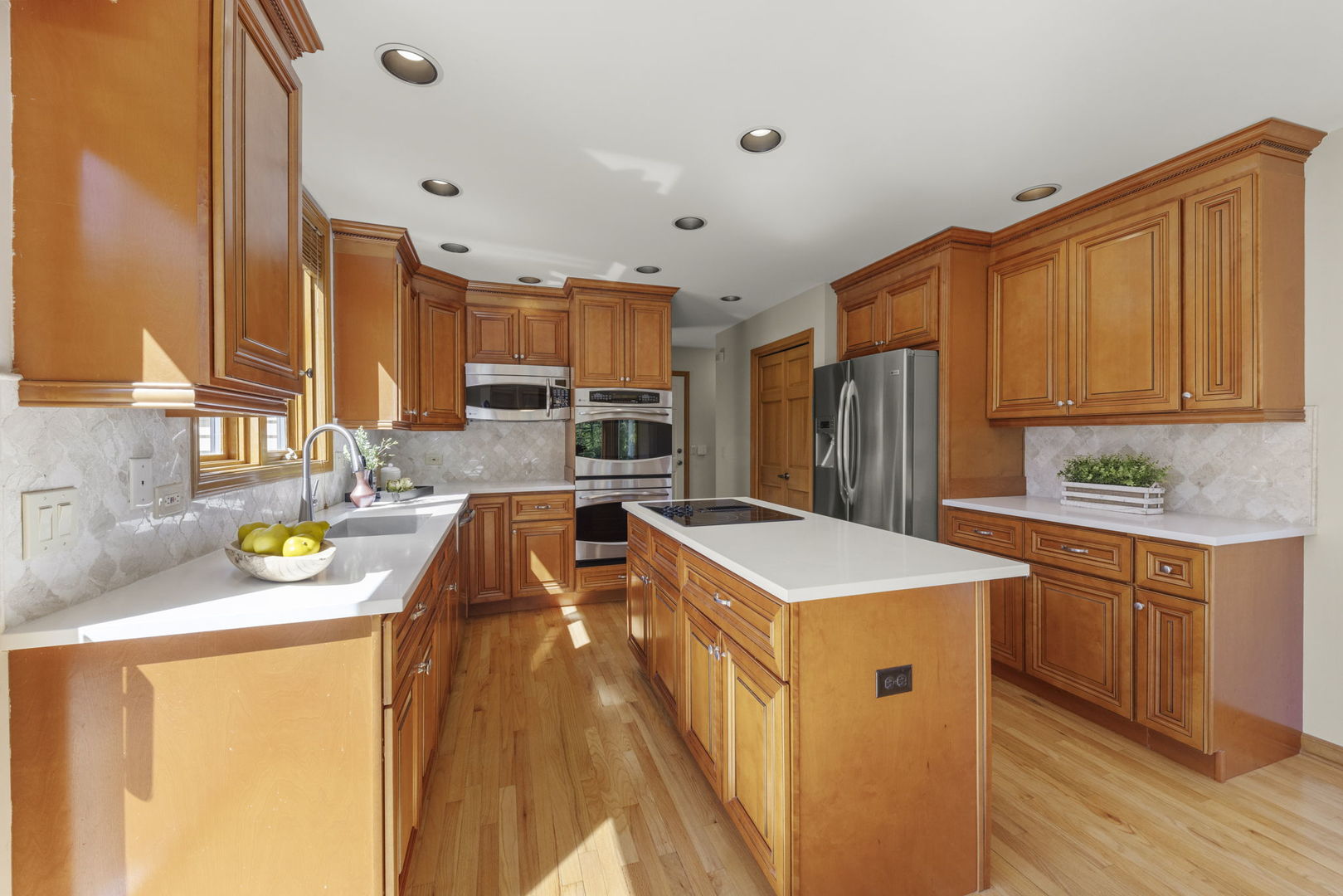 6621 Greene Road Woodridge, IL 60517 - Photo 15 of 42 a kitchen with stainless steel appliances granite countertop a sink a stove and a refrigerator
