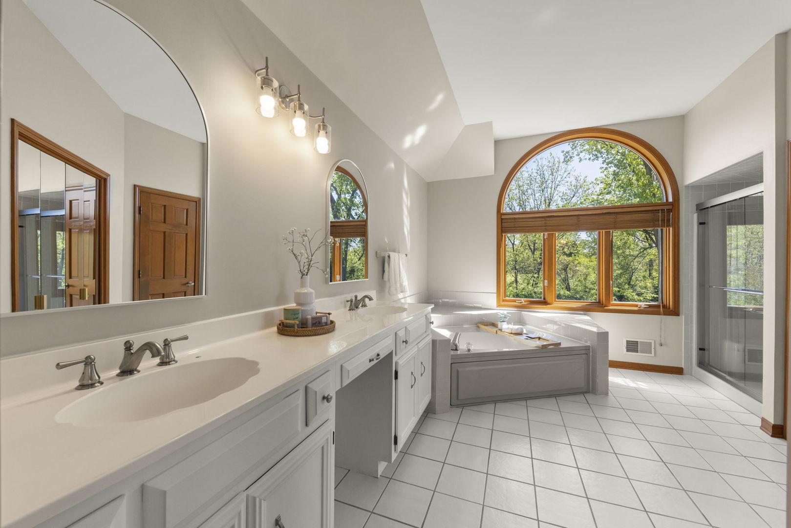 6621 Greene Road Woodridge, IL 60517 - Photo 21 of 42 a bathroom with a granite countertop sink mirror and a large window