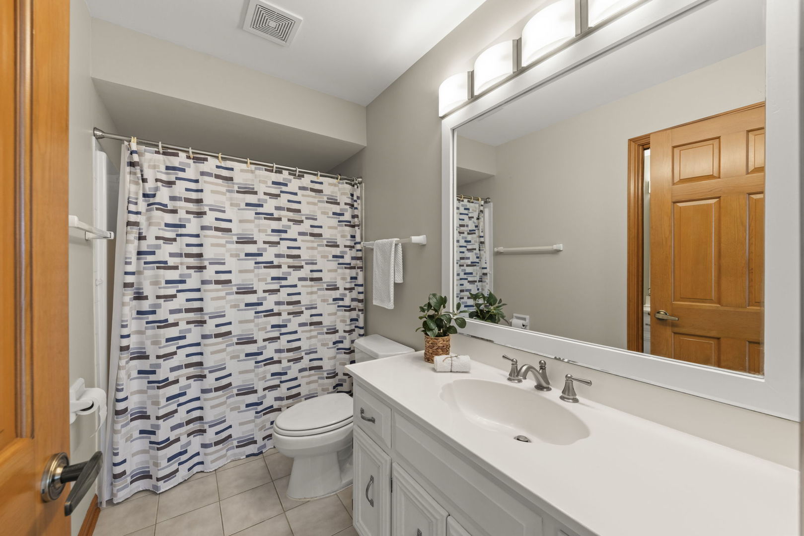 6621 Greene Road Woodridge, IL 60517 - Photo 26 of 42 a bathroom with a sink a toilet and shower