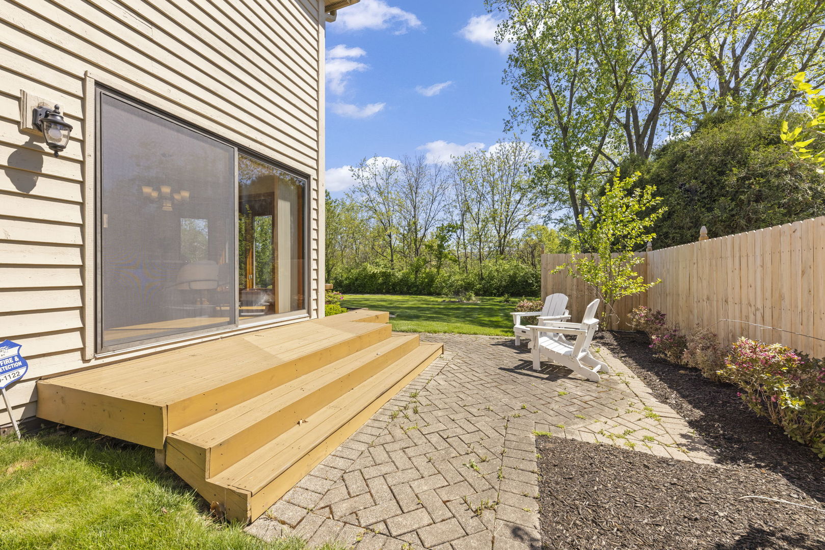 6621 Greene Road Woodridge, IL 60517 - Photo 35 of 42 a backyard of a house with yard and outdoor seating