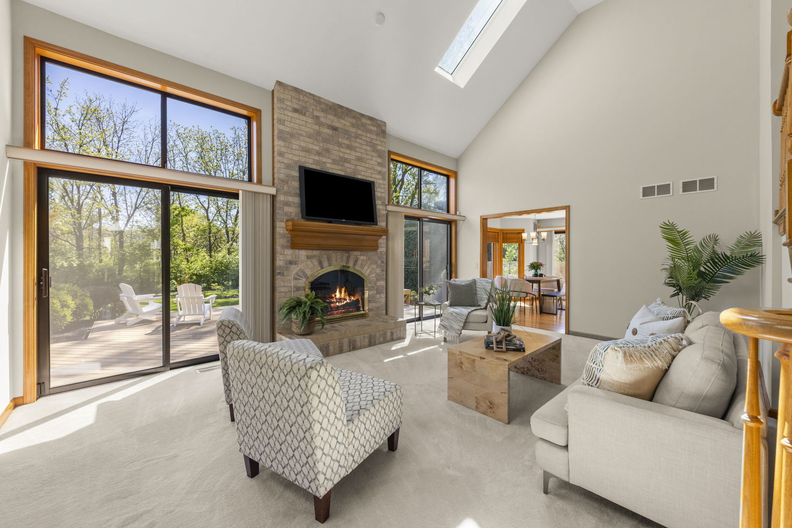 6621 Greene Road Woodridge, IL 60517 - Photo 10 of 42 a living room with furniture a fireplace and a large window