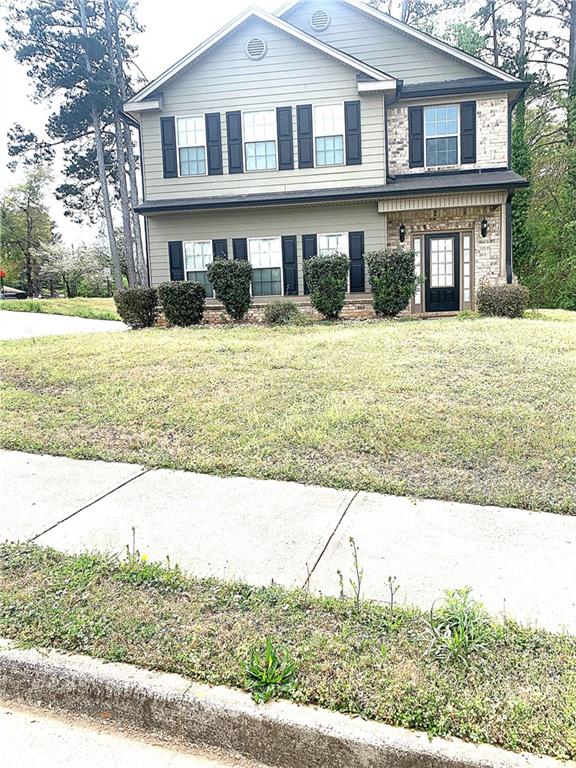 8198 Laurel Drive Southwest Covington, GA 30014 - Photo 1 of 1 a front view of a house with a yard