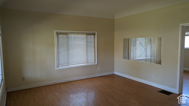 1341 East Crk Road Sandy, UT 84093 - Photo 15 of 24 Spare room with wood finished floors and baseboards