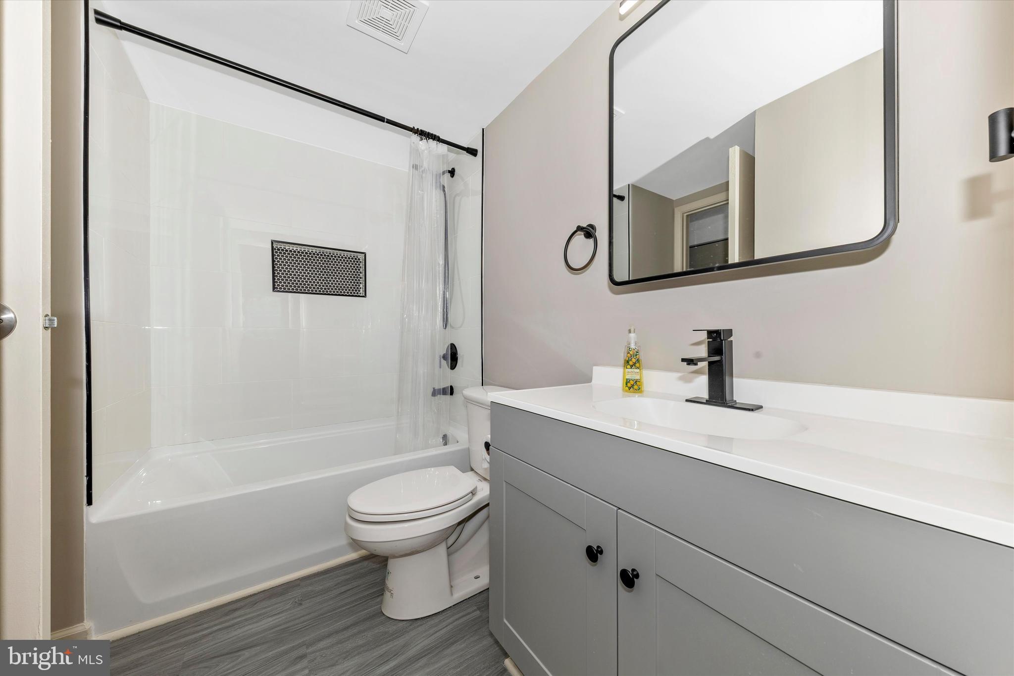 5818 Drawbridge Court Frederick, MD 21703 - Photo 24 of 36 New bath w/ LVP, tub &tile, vanity, mirror & light