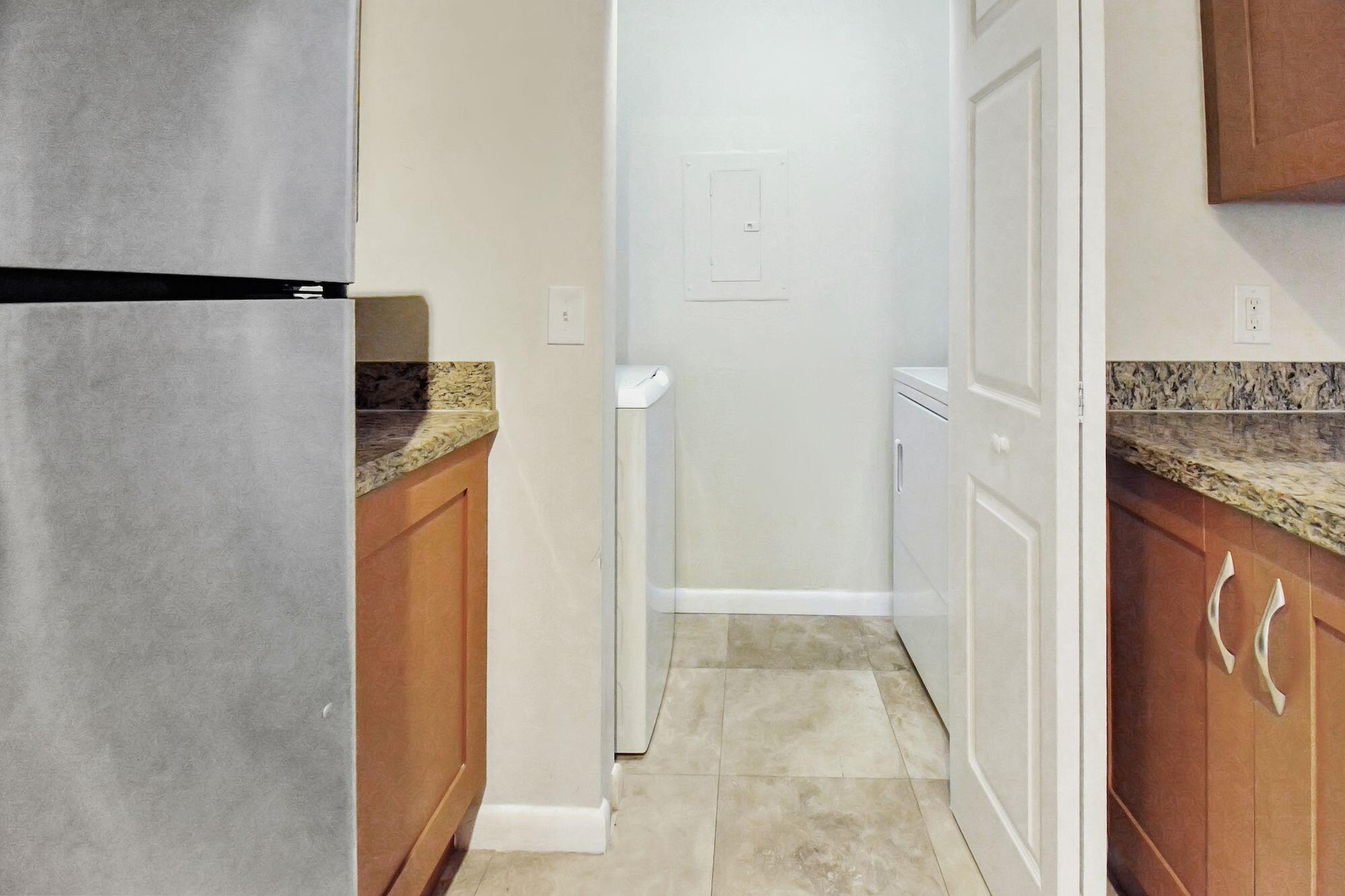 3131 Clint Moore Road, Unit 108 Boca Raton, FL 33496 - Photo 11 of 35 Kitchen to Laundryroom