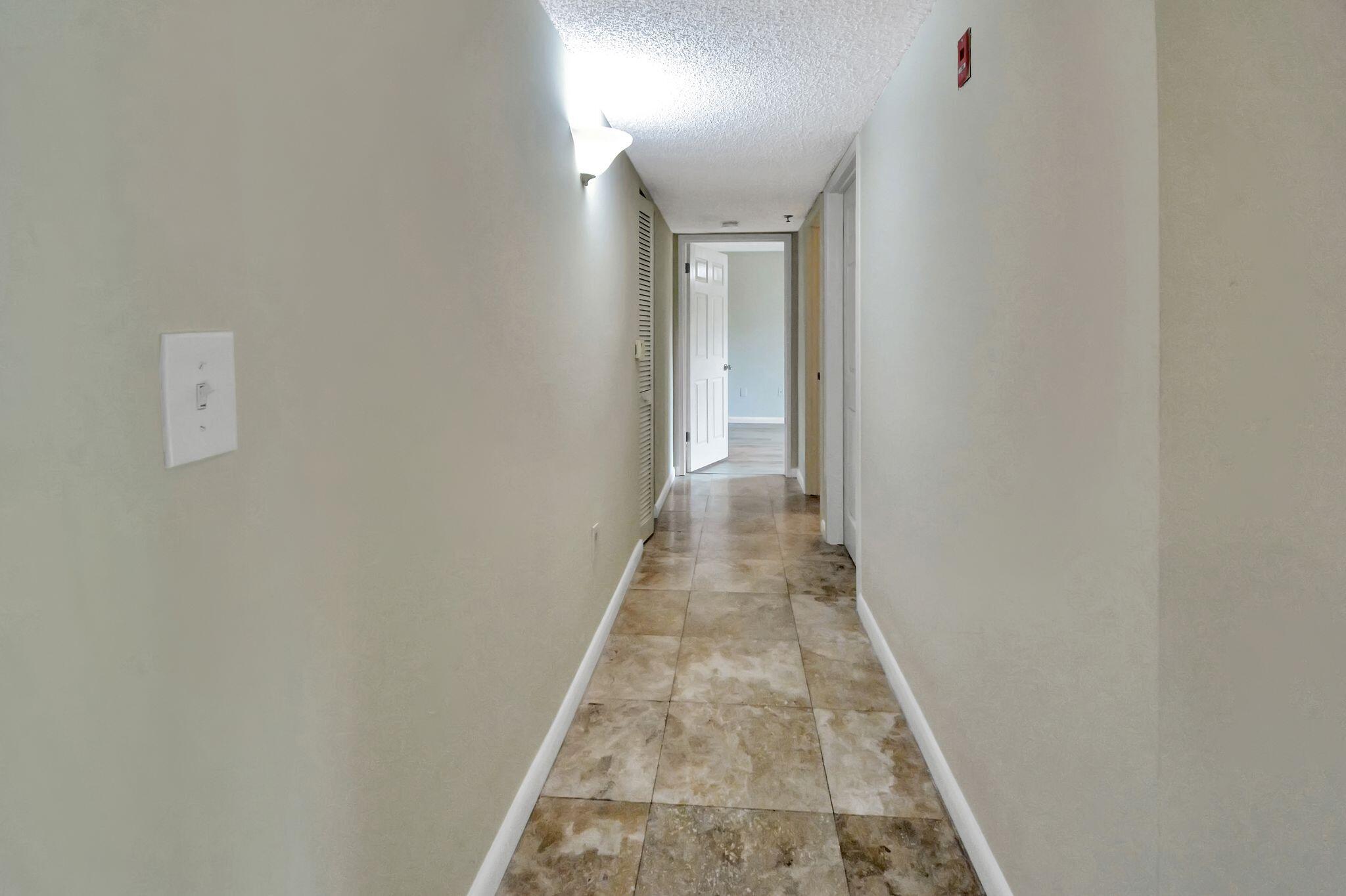 3131 Clint Moore Road, Unit 108 Boca Raton, FL 33496 - Photo 17 of 35 Hallway