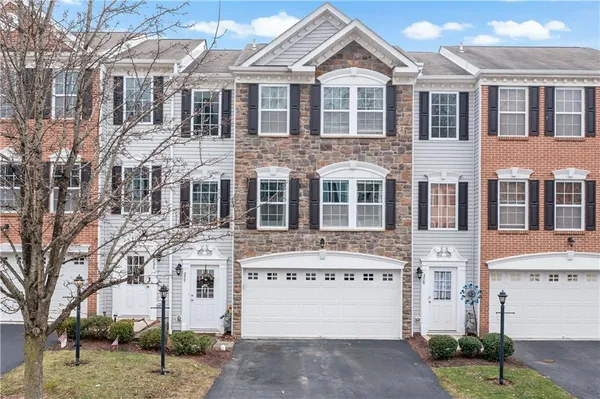 a front view of a building with lot of windows
