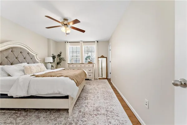 a bedroom with a bed and window