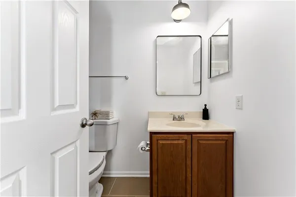 a bathroom with a sink vanity and a mirror