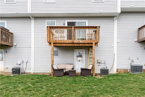 a view of a balcony with wooden floor