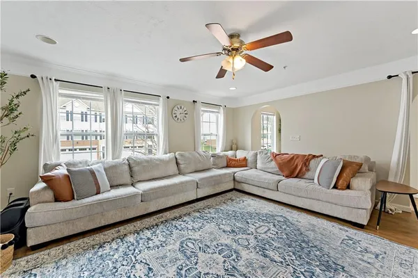 a living room with furniture and a large window