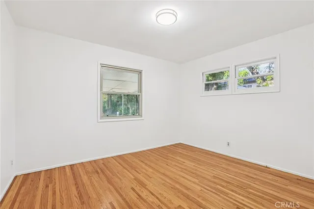 a view of a house with a yard patio and swimming pool