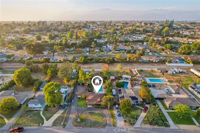 an aerial view of residential houses with outdoor space