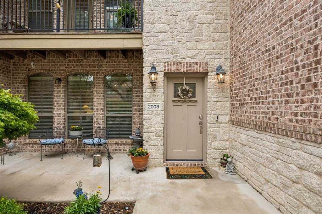 2003 Downing Street Allen, TX 75013 - Photo 29 of 40 The covered patio and the upper balcony provide outdoor living spaces with distinctive style.