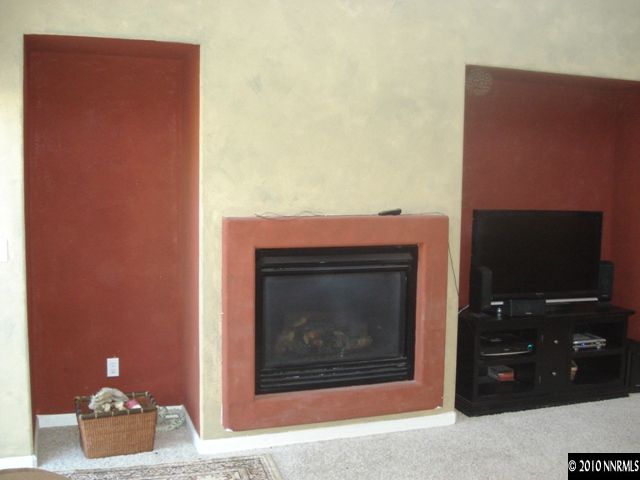 599 Needles Court Reno, NV 89521 - Photo 13 of 13 a living room with furniture and a fireplace