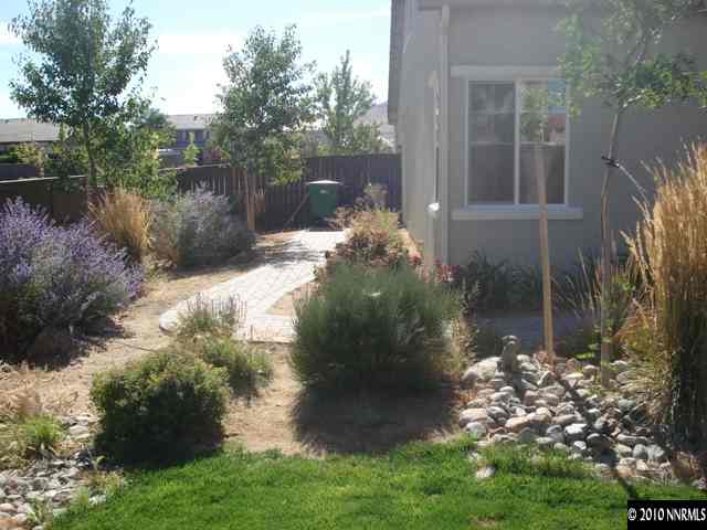 599 Needles Court Reno, NV 89521 - Photo 10 of 13 a view of a lake with a garden