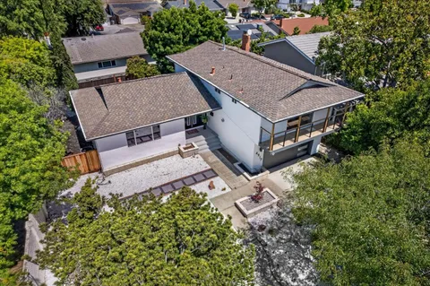 an aerial view of a house with a garden