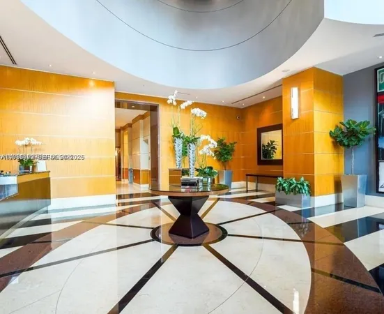 a living room with dining table and a large window