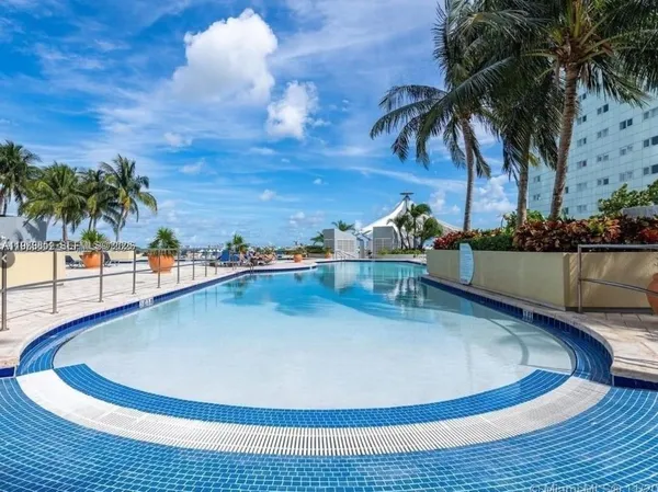 a view of a swimming pool with lounge chair