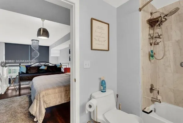 a living room with furniture and a toilet