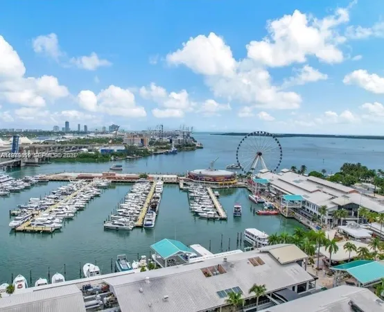 an aerial view of a house with a lake view