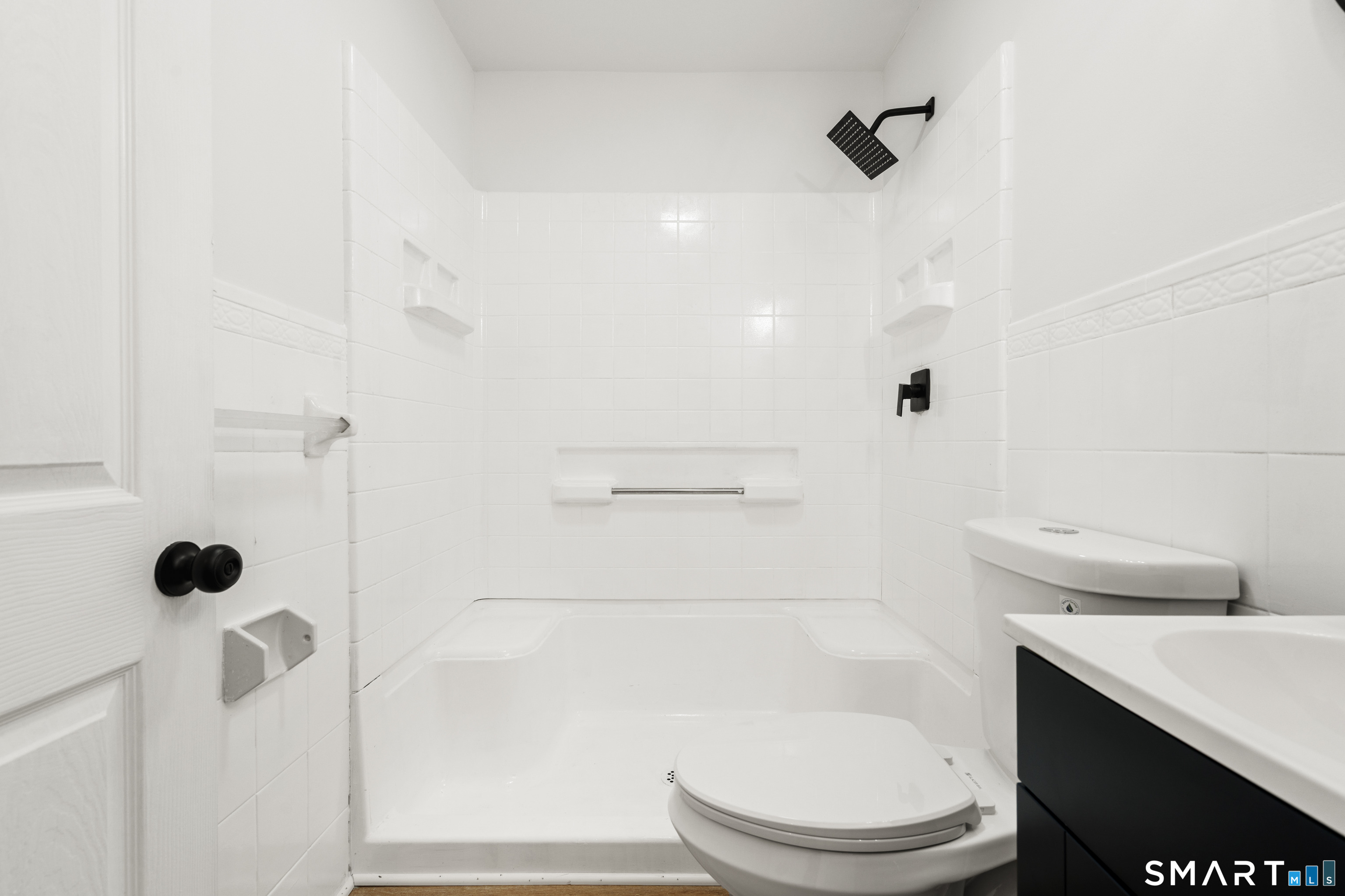175 Moody Street Bristol, CT 06010 - Photo 17 of 28 a bathroom with a toilet and a shower