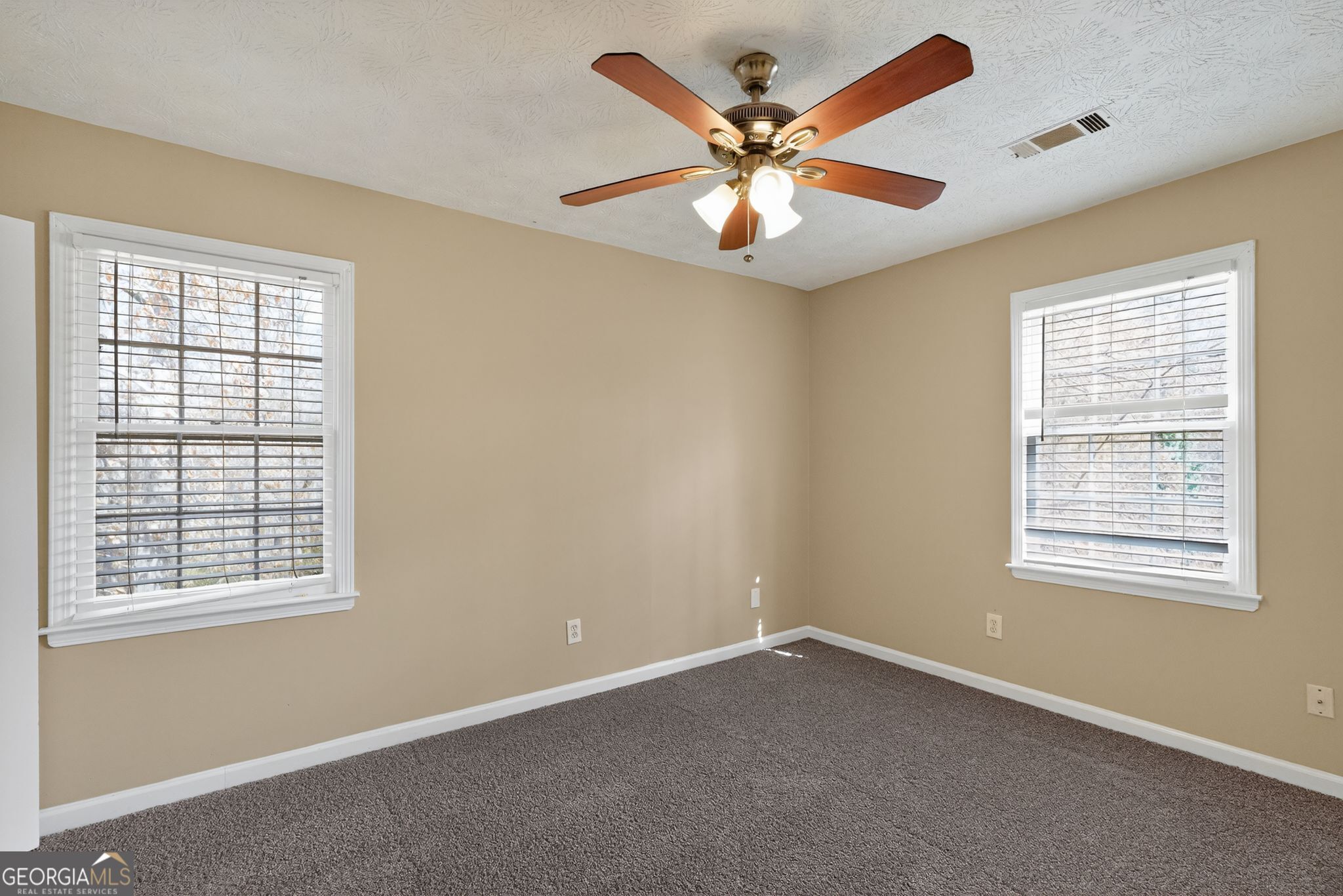 4716 Jakes Trail Decatur, GA 30034 - Photo 15 of 34 an empty room with a window and a fan