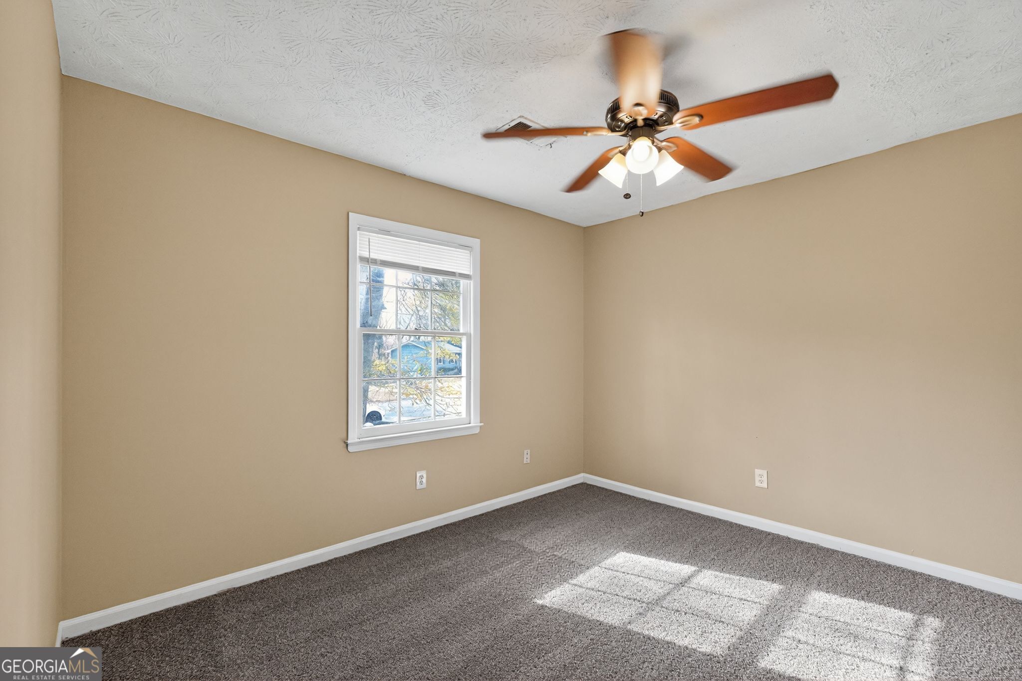4716 Jakes Trail Decatur, GA 30034 - Photo 16 of 34 an empty room with a window and a fan