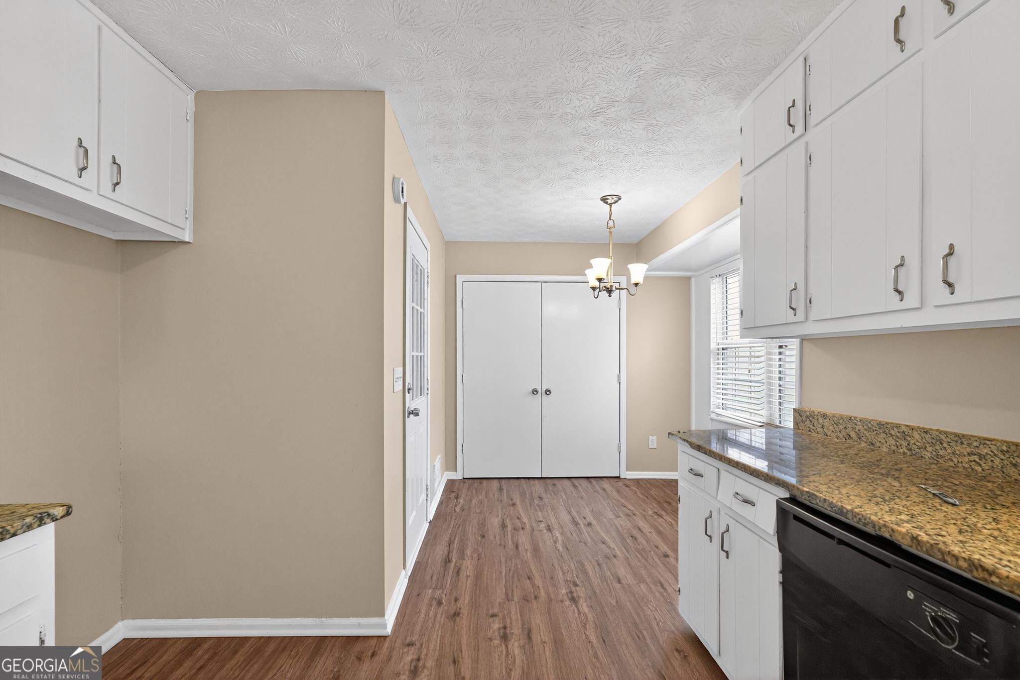4716 Jakes Trail Decatur, GA 30034 - Photo 9 of 34 a kitchen with cabinets and wooden floor