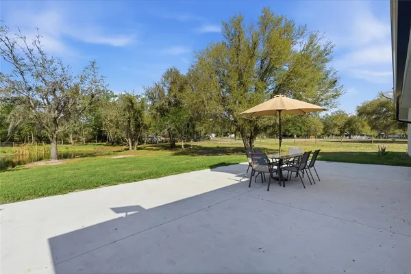 a view of bench and trees in the park
