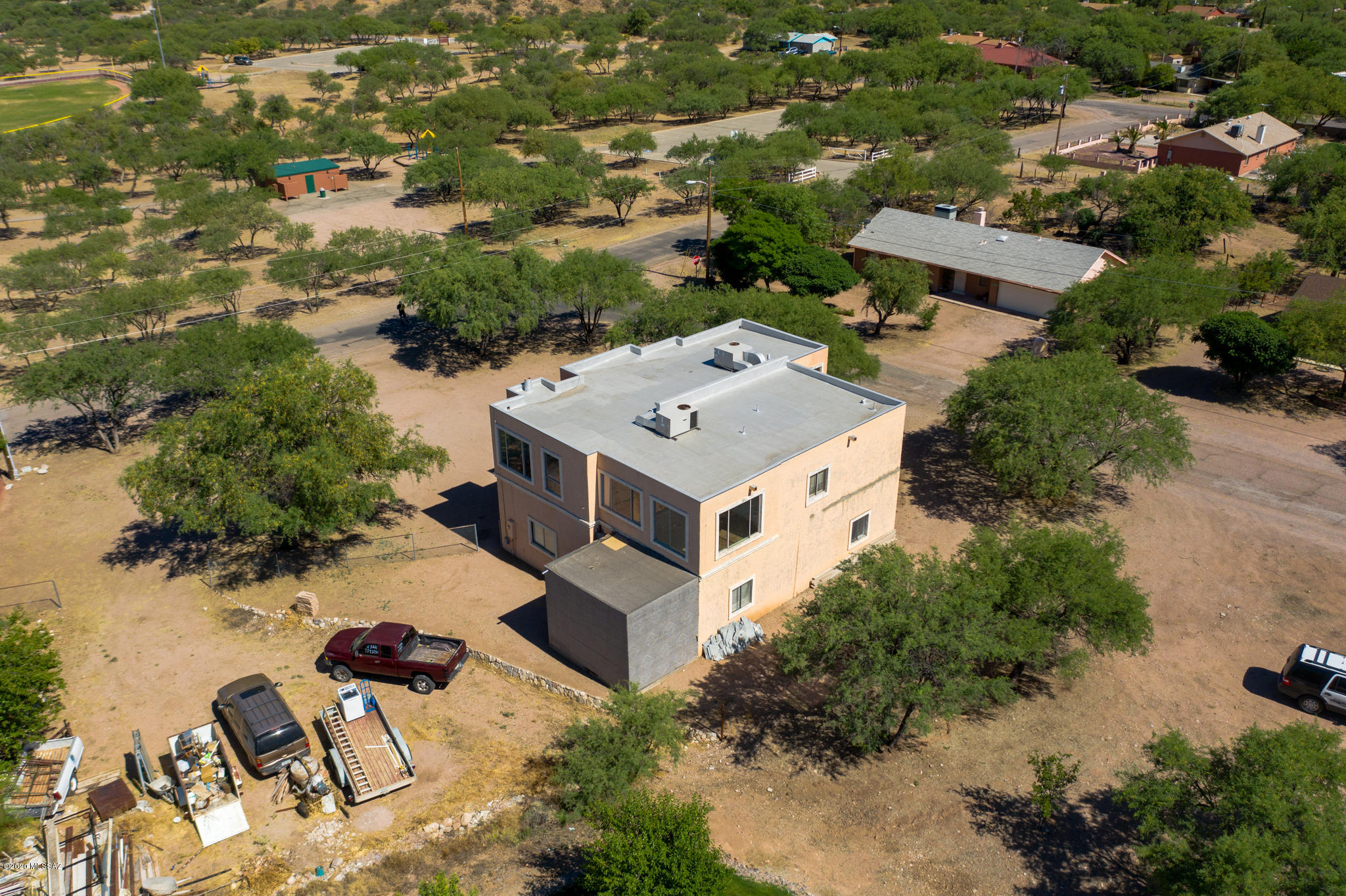 964 Calle Robalo Rio Rico, AZ 85648 - Photo 30 of 35 an aerial view of a house with yard and lake view