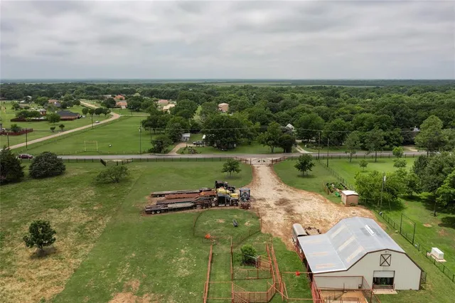 an aerial view of a house with a lake view