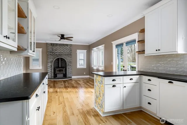 a view of kitchen with furniture and wooden floor