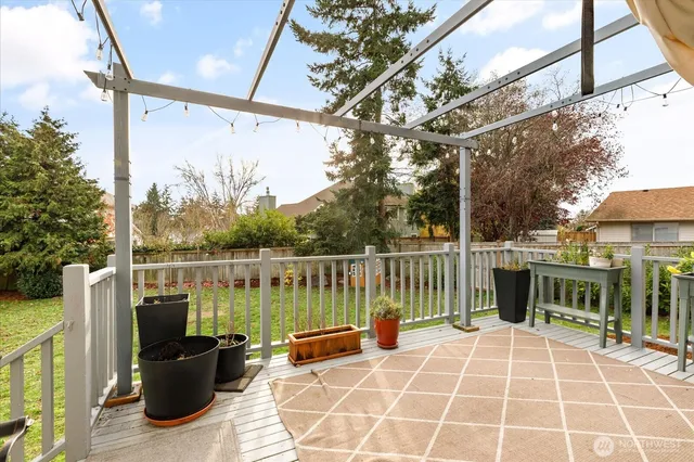 a view of a house with backyard and porch