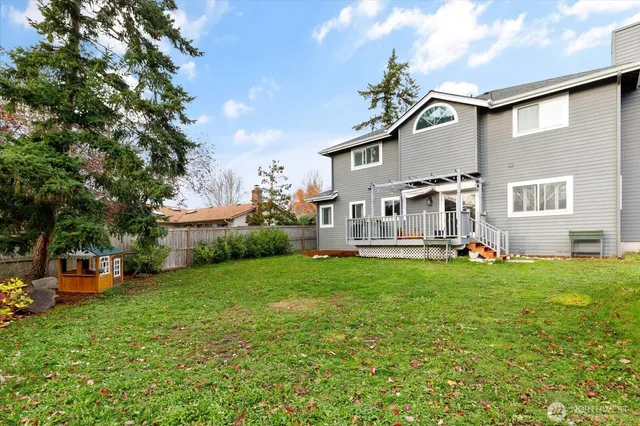 a backyard of a house with lots of green space