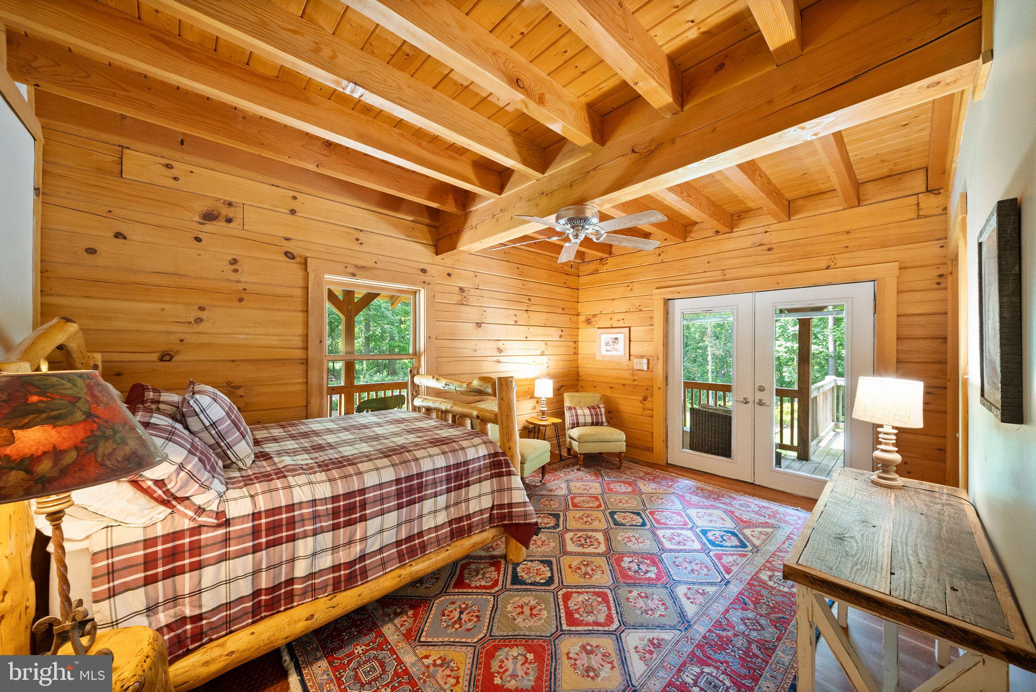 4020 Millwood Road Boyce, VA 22620 - Photo 41 of 132 Additional main level bedroom with exposed beams.