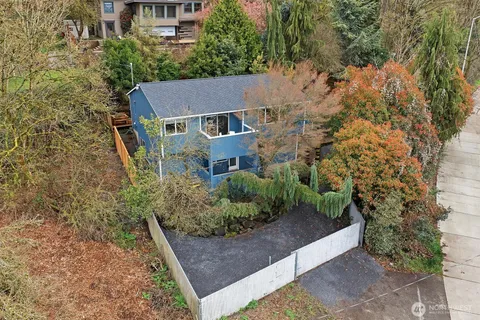 aerial view of a house with a yard