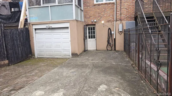 a view of a building with cars parked