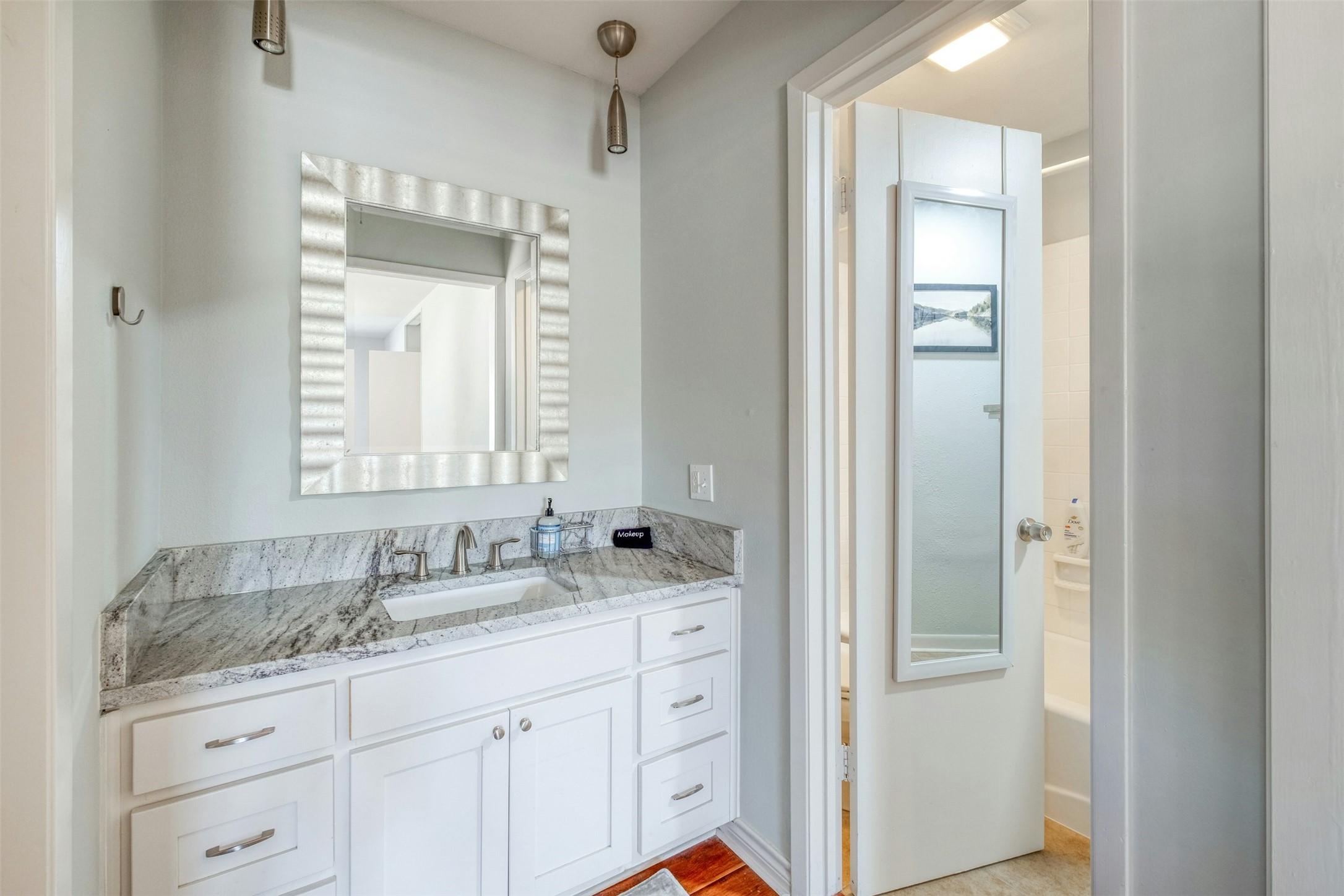 1208 Country Club Road Georgetown, TX 78628 - Photo 18 of 25 a bathroom with a granite countertop sink and a mirror