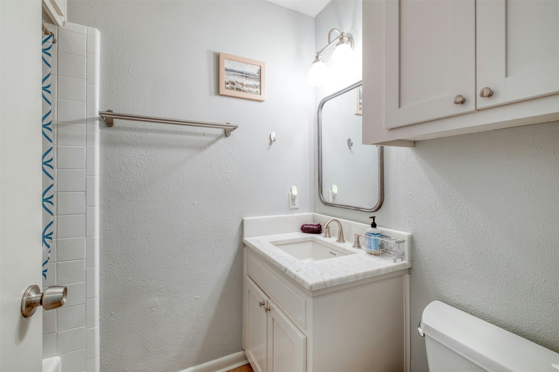 1208 Country Club Road Georgetown, TX 78628 - Photo 21 of 25 a bathroom with a sink and mirror