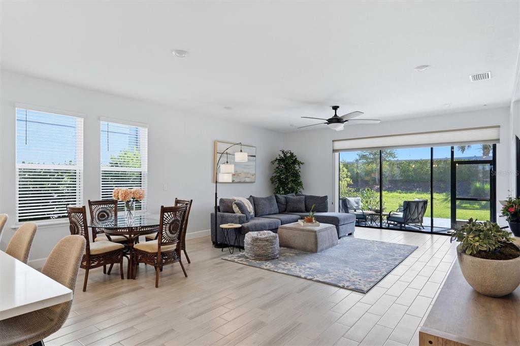 9268 Tequila Sunrise Drive Sarasota, FL 34241 - Photo 8 of 56 a living room with furniture and large windows