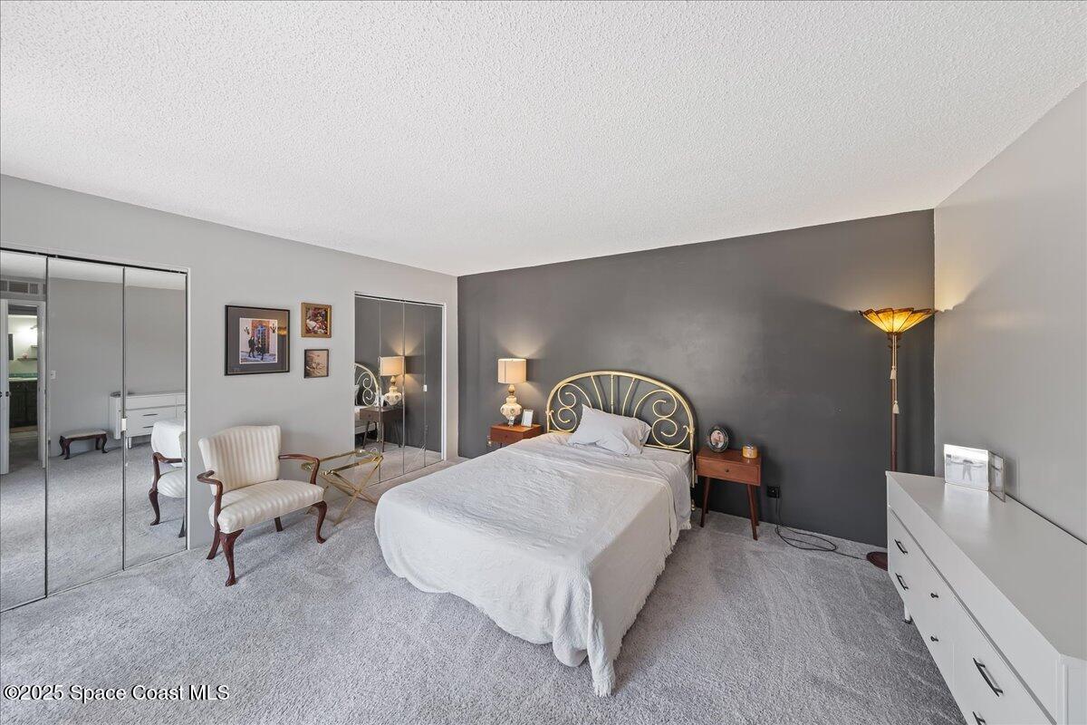 2012 Dan Court Palm Bay, FL 32905 - Photo 18 of 22 a bedroom with a bed and lamp