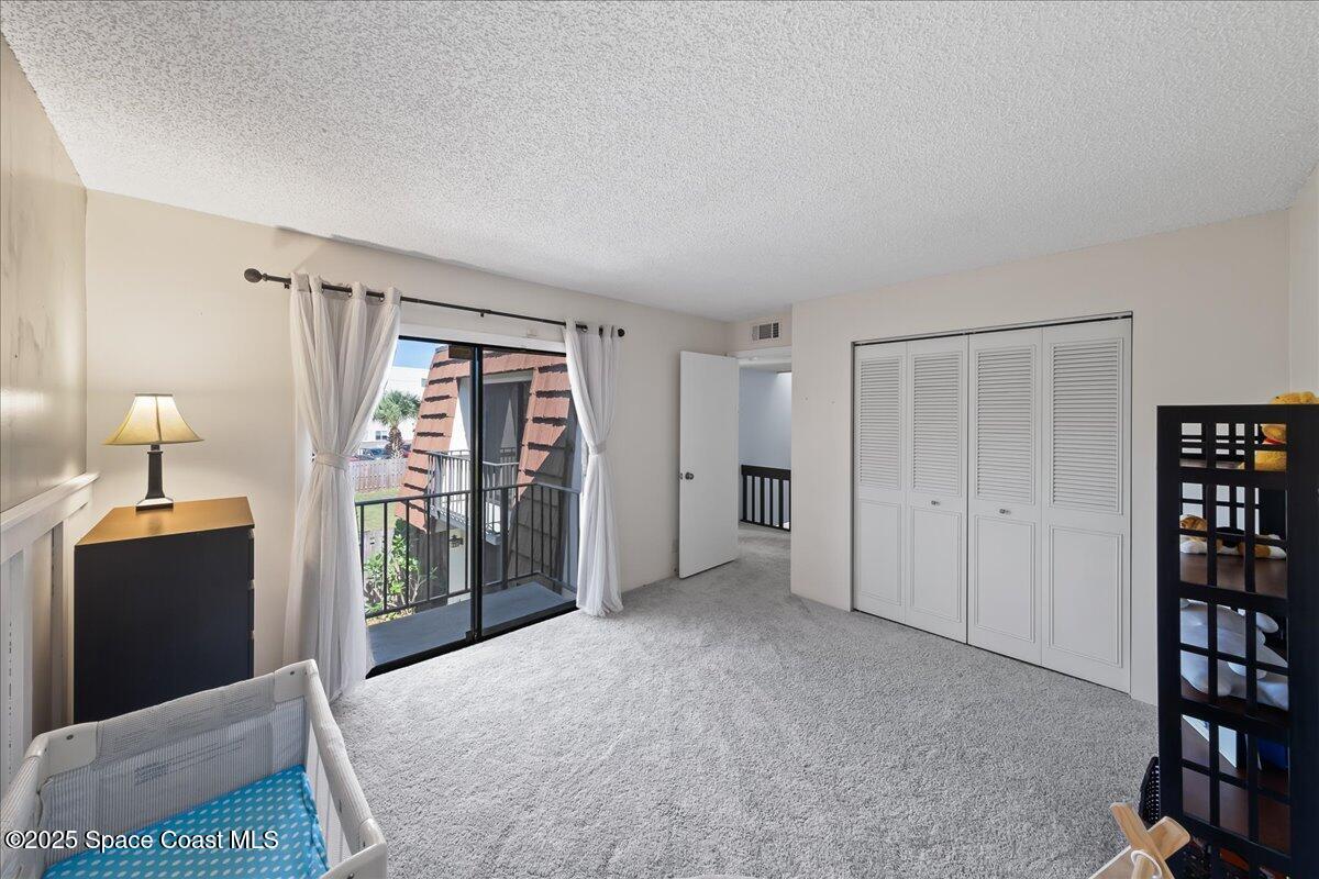 2012 Dan Court Palm Bay, FL 32905 - Photo 21 of 22 a view of a bedroom with furniture and closet