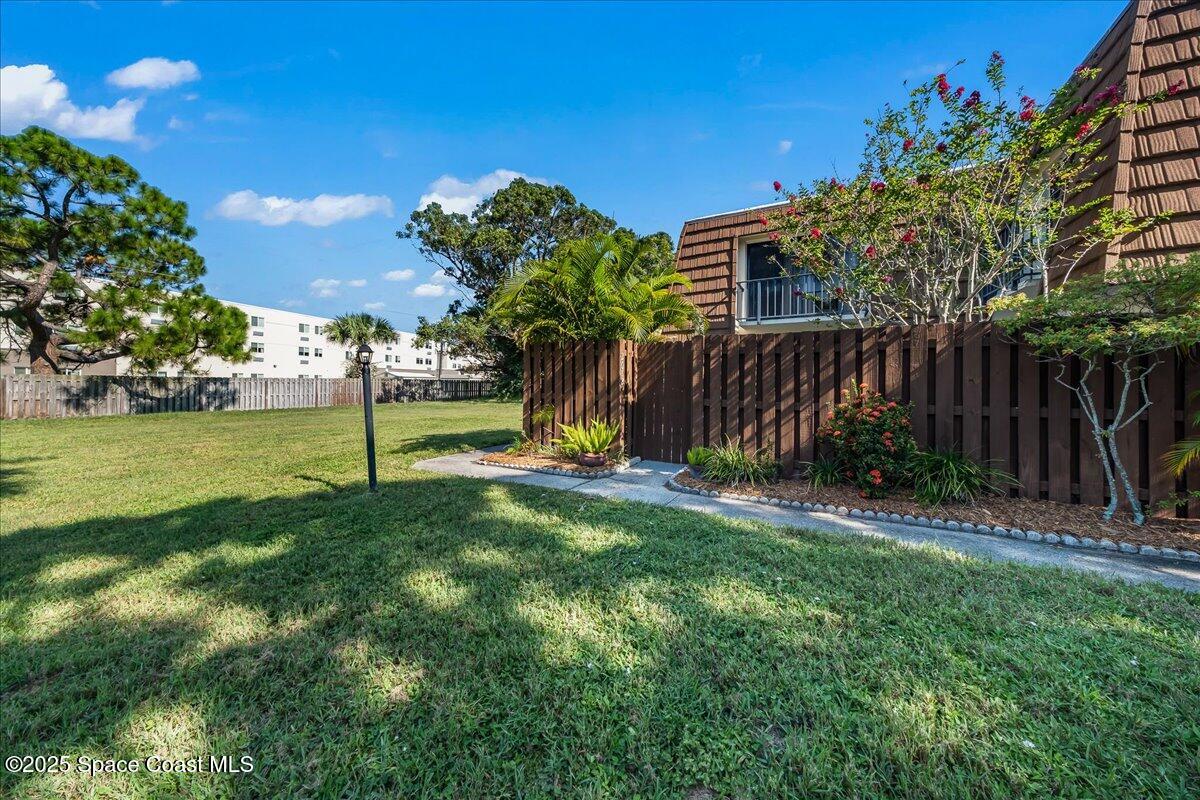 2012 Dan Court Palm Bay, FL 32905 - Photo 4 of 22 a view of a backyard with palm trees