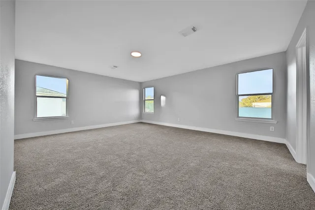 a view of an empty room and window