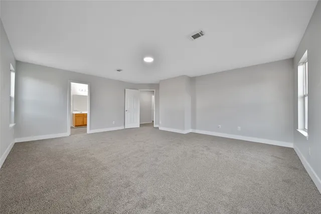 a view of cabinets and wooden floor