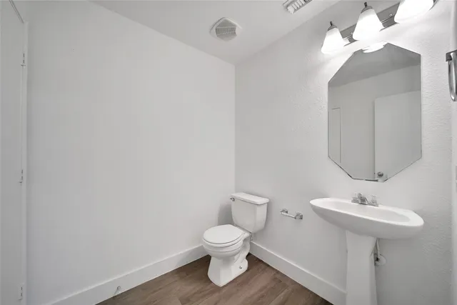 a kitchen with stainless steel appliances a sink stove and cabinets