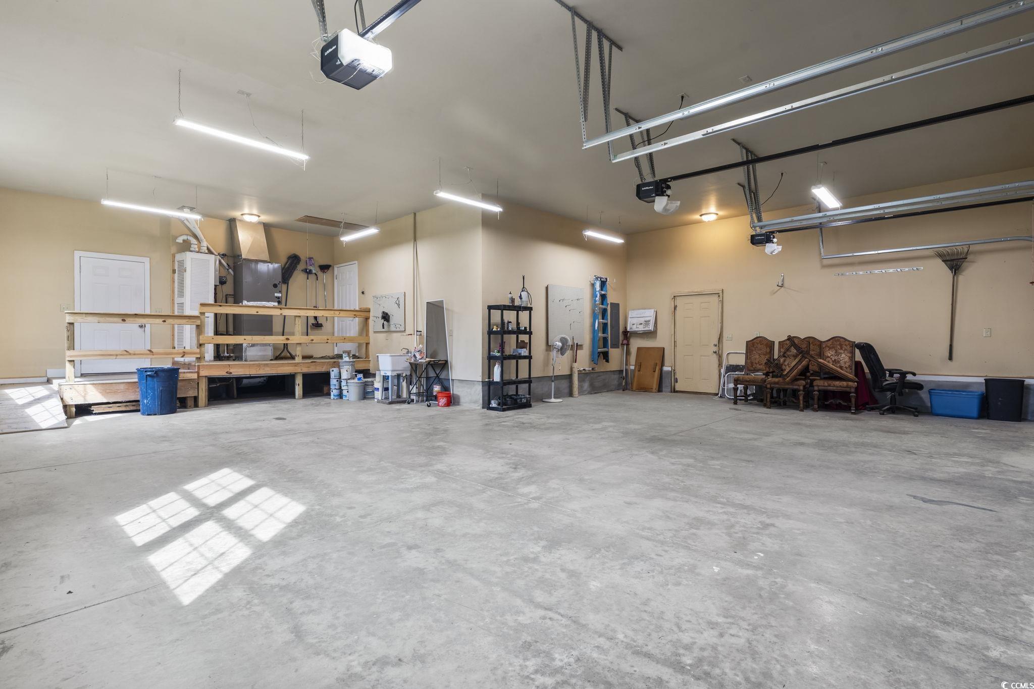 1585 Daisy Road Loris, SC 29569 - Photo 26 of 48 Garage featuring a garage door opener