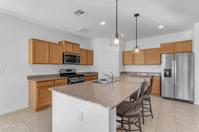a bedroom with bed and painting on the wall