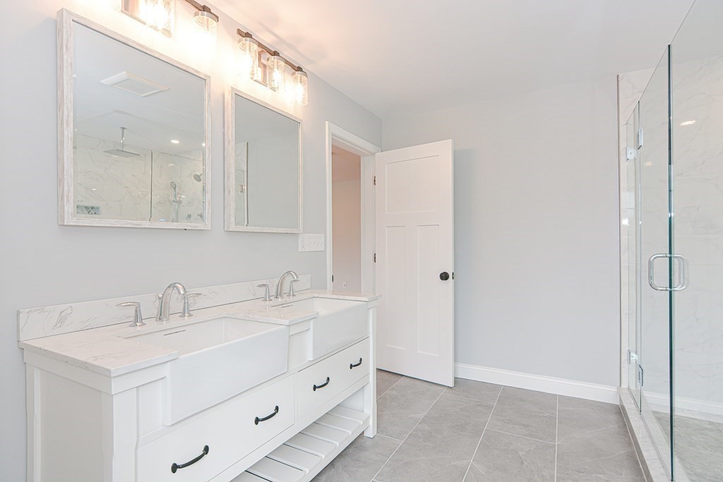 3 Badus Brook Road Wrentham, MA 02093 - Photo 24 of 38 a bathroom with a sink and a mirror